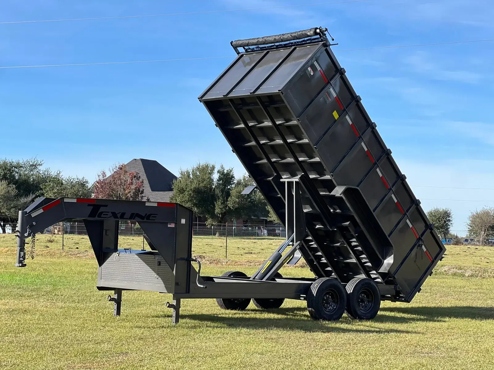 Texline gooseneck dump trailer with the bed raised